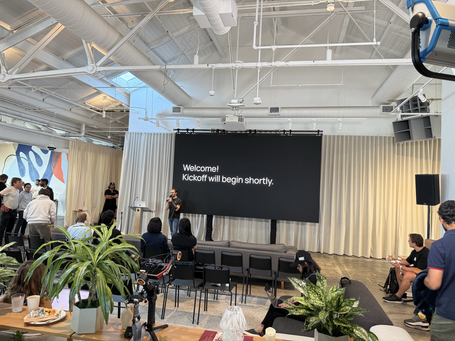 Attendees gathering for the hackathon kickoff presentation
